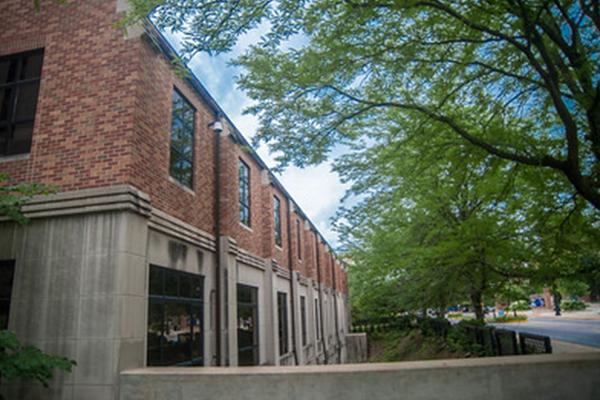 Registrar menu item view of Parson's Hall from the sidewalk. 